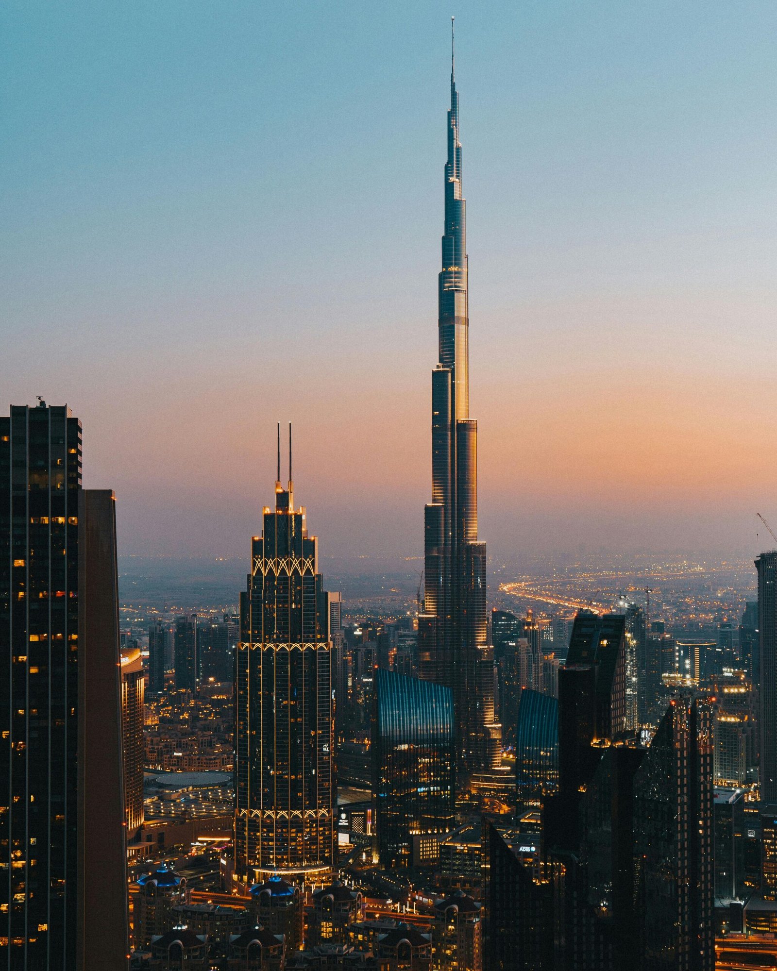 A stunning view of the Dubai skyline with Burj Khalifa during a vibrant dusk.